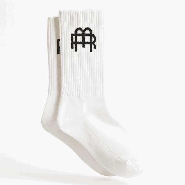 A_digital_photograph_displays_a_pair_of_white_crew